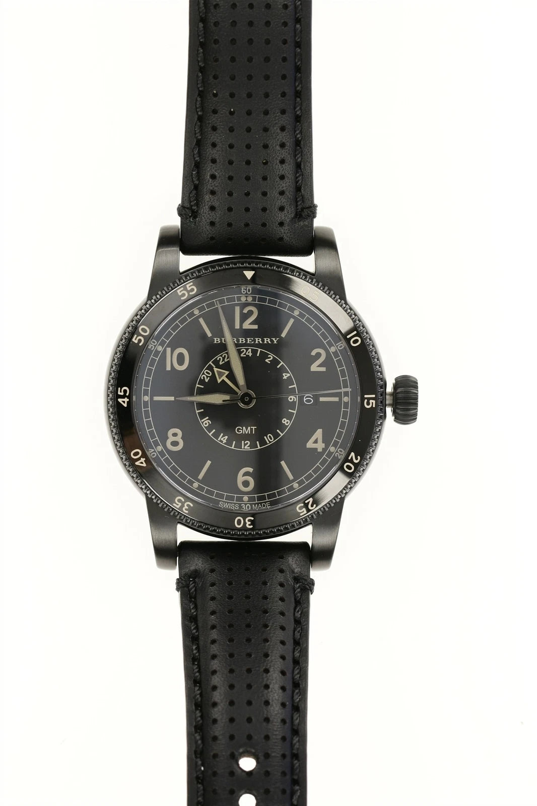 Burberry Utilitarian GMT men's watch with black dial, subdial, Arabic numerals, and black perforated leather strap