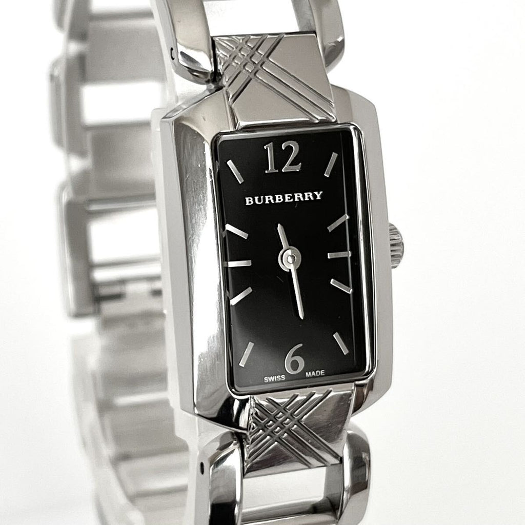Three-quarter view of Burberry Signature BU4210 watch showing rectangular case and quilted bracelet