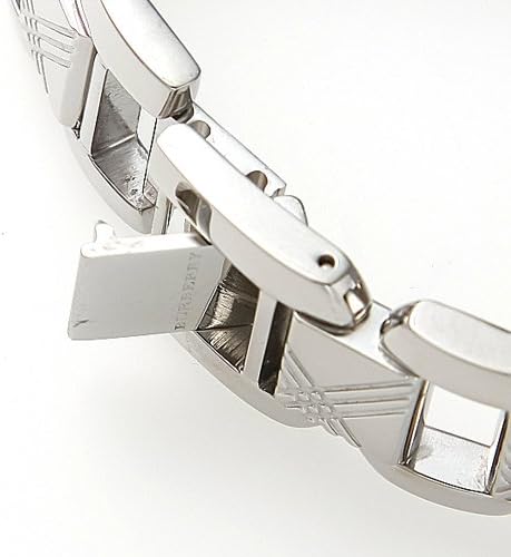 Close-up of stainless steel bracelet with iconic checked pattern detail