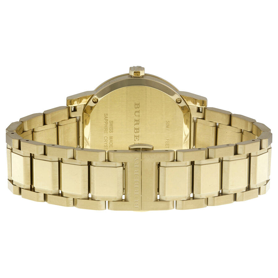 Burberry The City watch caseback showing gold-tone stainless steel with engraved branding and text