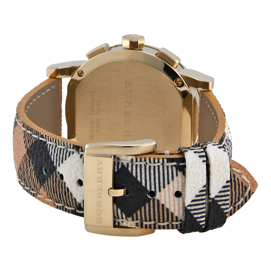 Caseback view of Burberry The City chronograph watch showing gold tone case and Haymarket check strap detail
