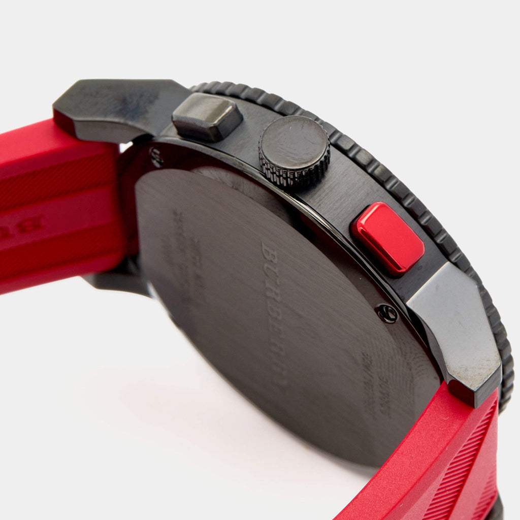 Detailed side view of case showing chronograph pusher, crown, and black steel construction