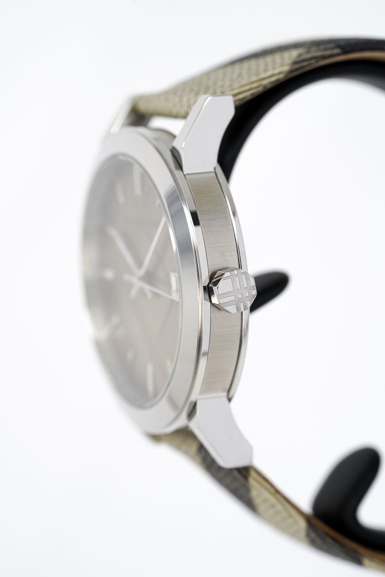 Side view of Burberry The City Nova watch showing silver case profile and brown leather strap