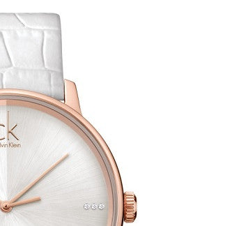 Close-up of Calvin Klein Accent dial showing minimalist markers and rose gold hands