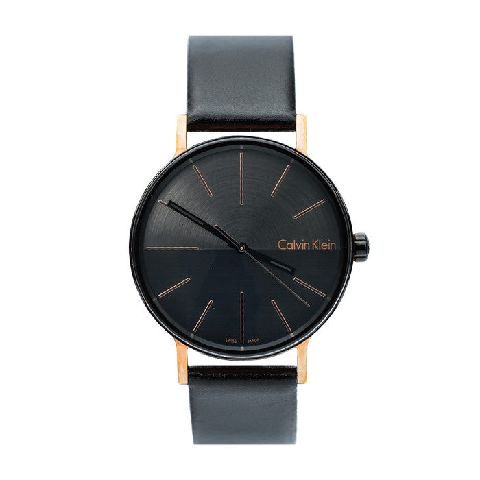 Calvin Klein Boost black watch face with rose gold hour markers, black leather band detail