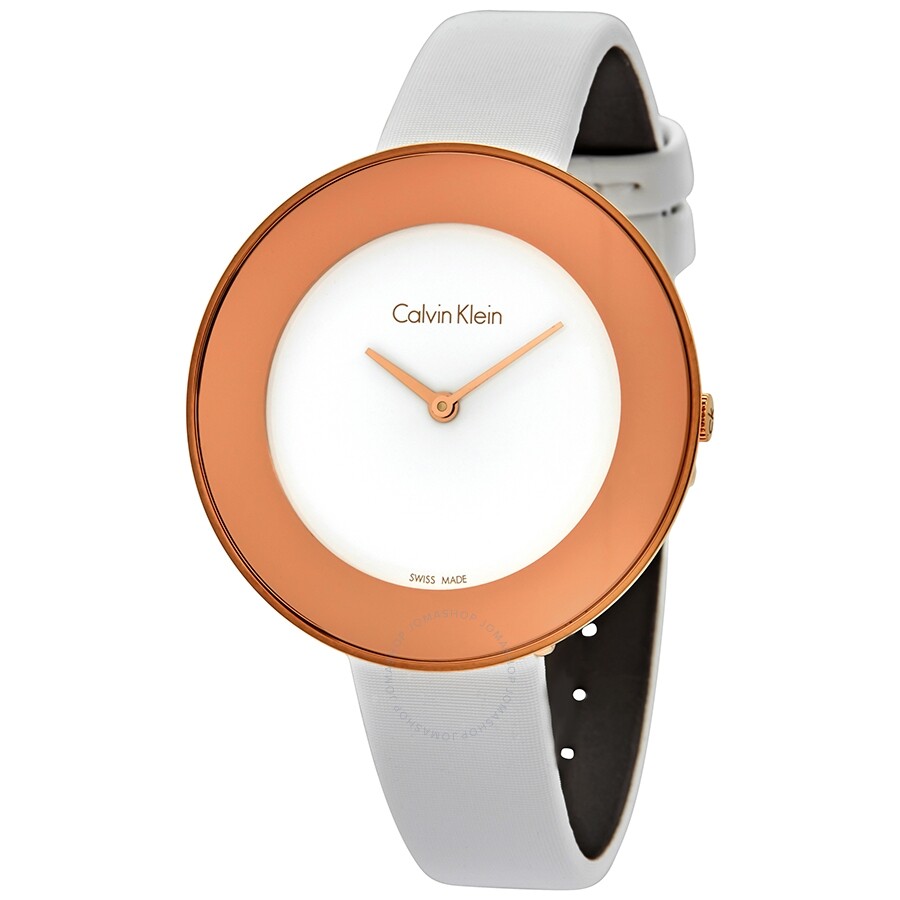 Calvin Klein Chic watch at angle showing three-quarter view with rose gold case and white strap