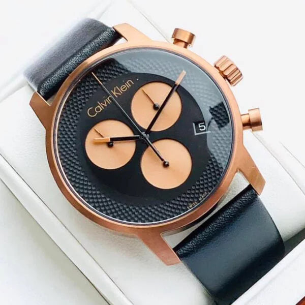 Calvin Klein City Chronograph on-wrist display showing black dial with copper subdials