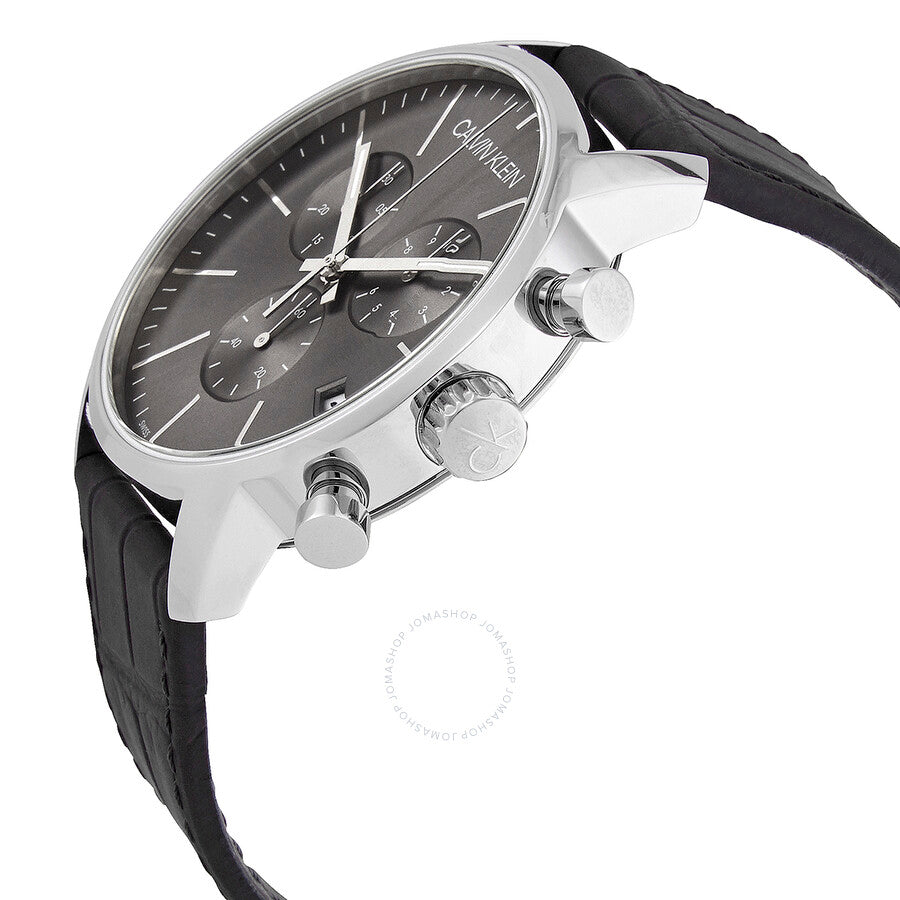 Calvin Klein City chronograph watch at angle showing silver case, black dial, and chronograph pushers