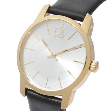 Calvin Klein City watch worn on wrist with gold case and black leather strap
