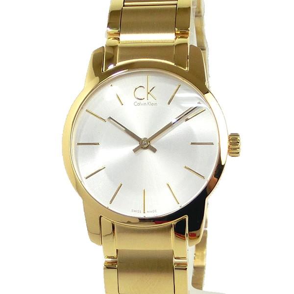 Calvin Klein City K2G23546 gold-tone watch worn on wrist with silver dial and matching bracelet