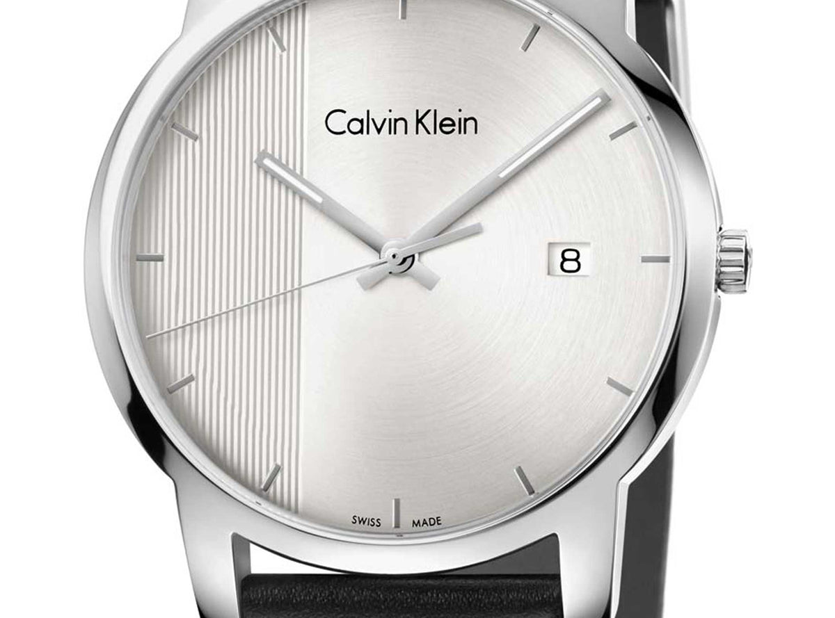 Close-up of Calvin Klein City dial showing silver finish and date window