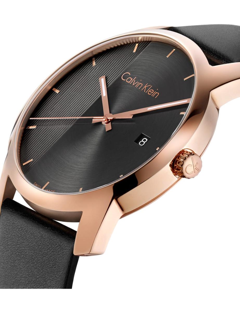 Angled side view of Calvin Klein City watch showing rose gold case, black dial, and black leather strap
