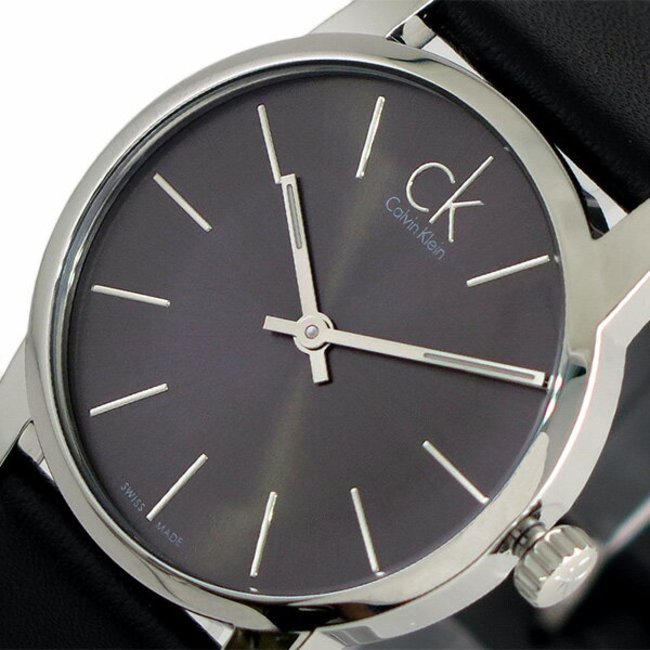 Close-up of City Lady black dial with silver hour markers and CK logo