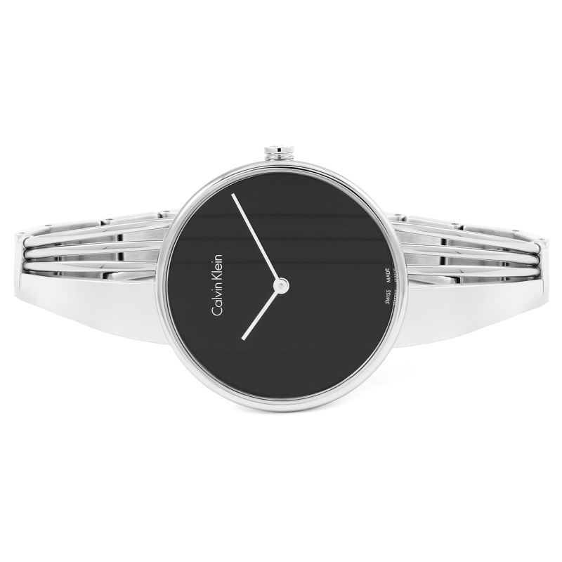 Calvin Klein Drift ladies watch on wrist showing black dial and polished silver bracelet