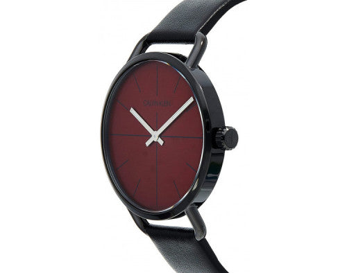 Calvin Klein Even watch at angle showing red dial and black leather strap