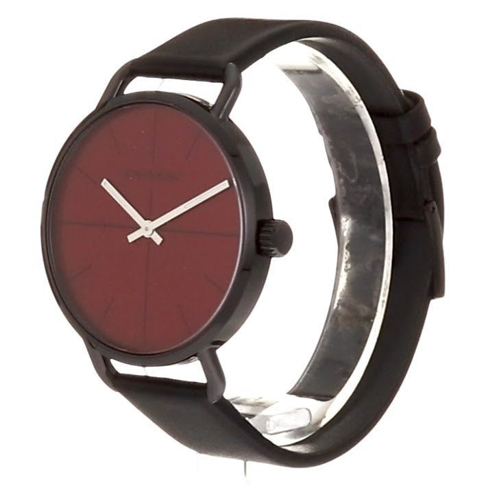 Calvin Klein Even watch worn on wrist showing red dial and black leather band