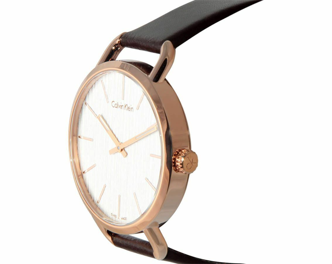 Calvin Klein Even watch at angle displaying white dial, rose gold bezel, and brown strap