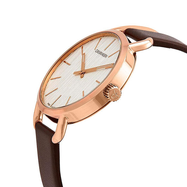 Side view of Calvin Klein Even watch showing rose gold case and brown leather band