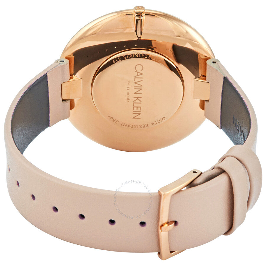 Calvin Klein Full Moon watch caseback showing rose gold case and tan leather strap