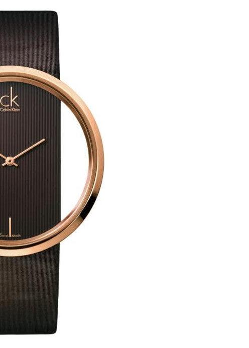 Side angle view of Calvin Klein Glam watch showing brown leather strap and rose gold case