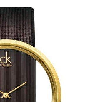Angled view of Calvin Klein Glam watch with transparent dial and leather strap