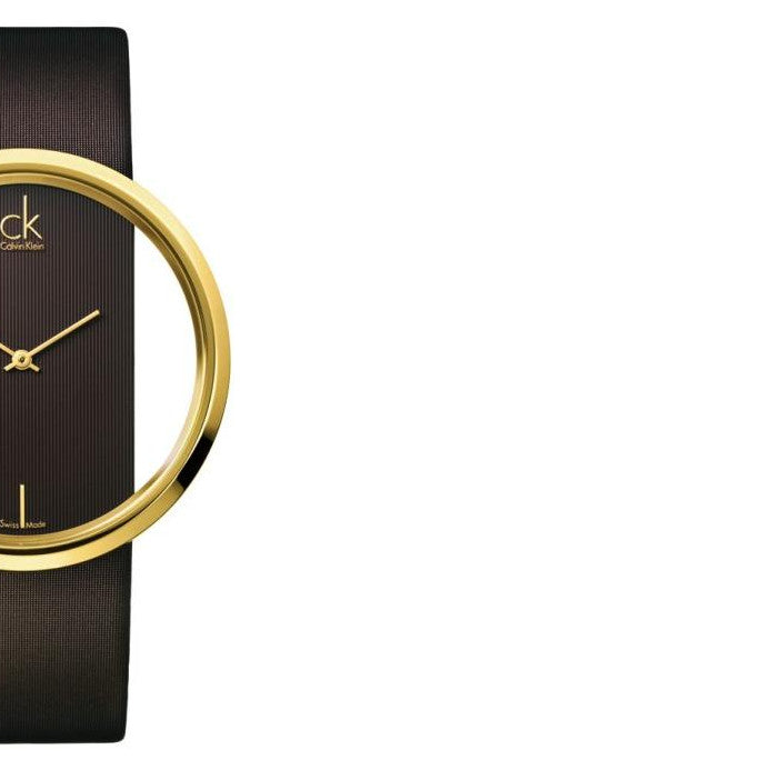 Side view of Calvin Klein Glam watch showing gold case and brown leather strap detail
