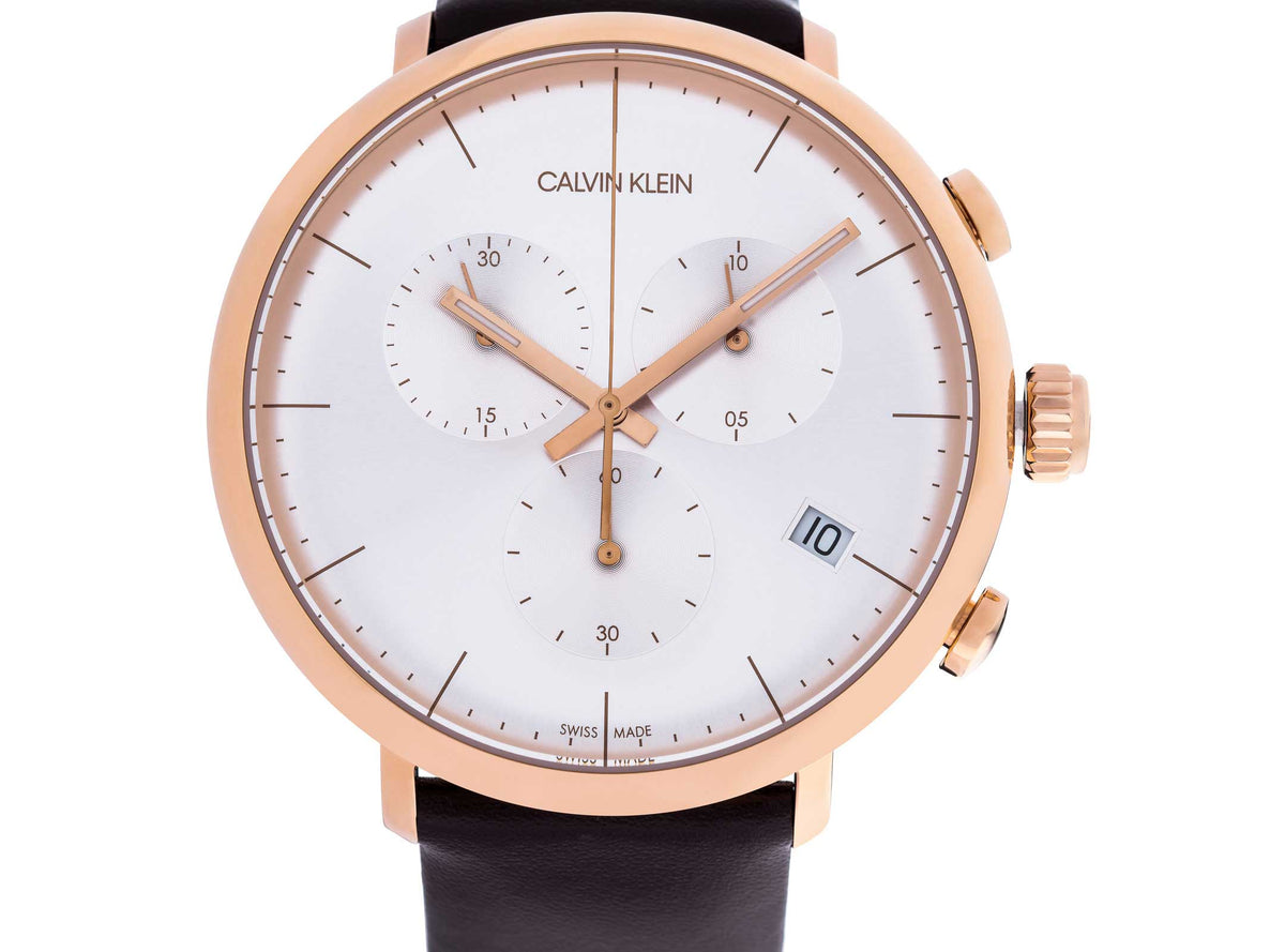 Calvin Klein High Noon chronograph watch displaying silver dial with rose gold hands and case