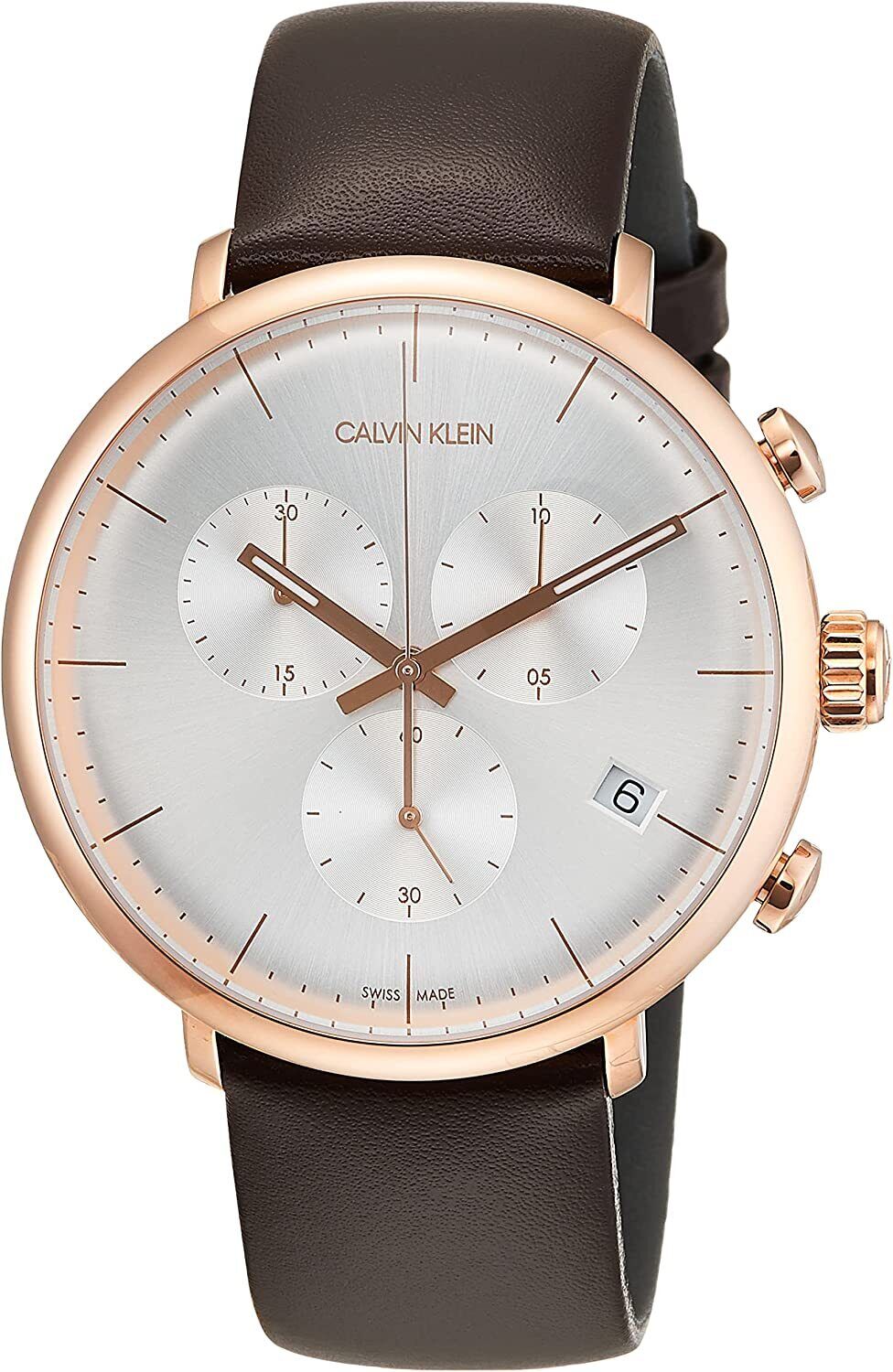 Calvin Klein High Noon chronograph watch with silver dial, rose gold case, and dark brown leather strap