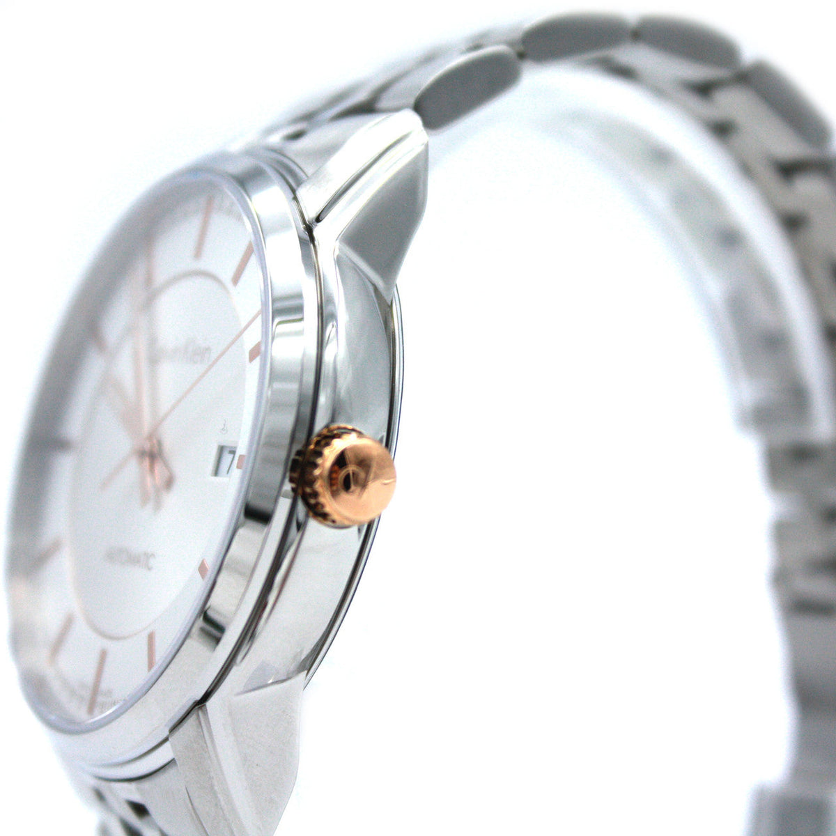 Side angle view of Calvin Klein Infinite automatic watch with stainless steel bracelet and rose gold crown