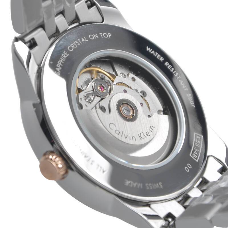 Calvin Klein Infinite automatic watch caseback displaying visible movement and water resistant specifications
