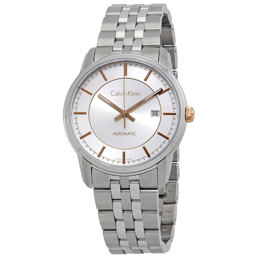 Calvin Klein Infinite automatic watch with white silver dial, rose gold hour markers, date window, and steel bracelet