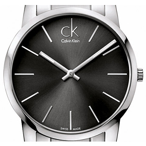 Close-up of Calvin Klein grey dial with minimalist hour markers and white hands