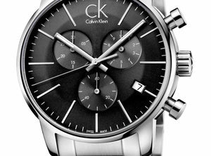 Close-up of black chronograph dial with three subdials and white hands