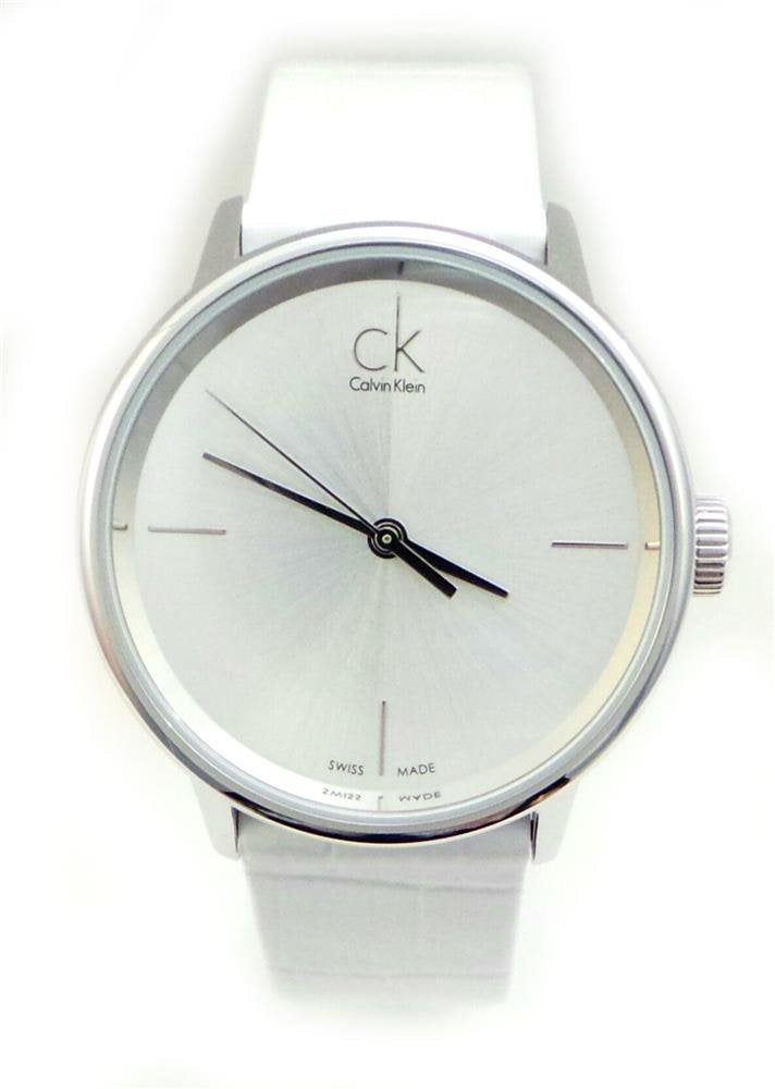 Calvin Klein Accent watch showing silver sunburst dial with hour markers and white strap