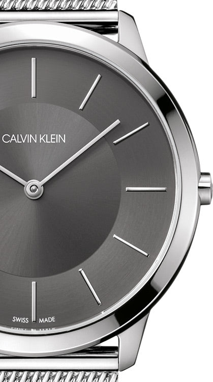 Close-up detail of ck Minimal K3M21124 dial with minimalist hour markers and Swiss Made marking