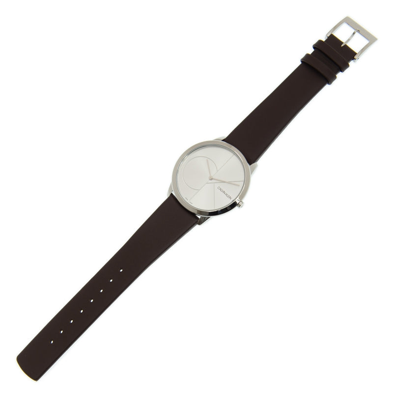 Calvin Klein K3M211G6 watch worn on wrist with brown leather strap