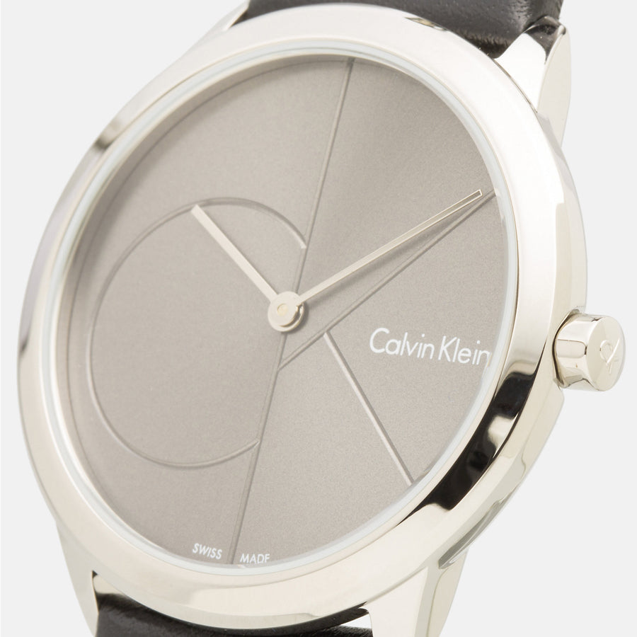 Close-up of Calvin Klein K3M221C3 grey dial with minimalist design and hands
