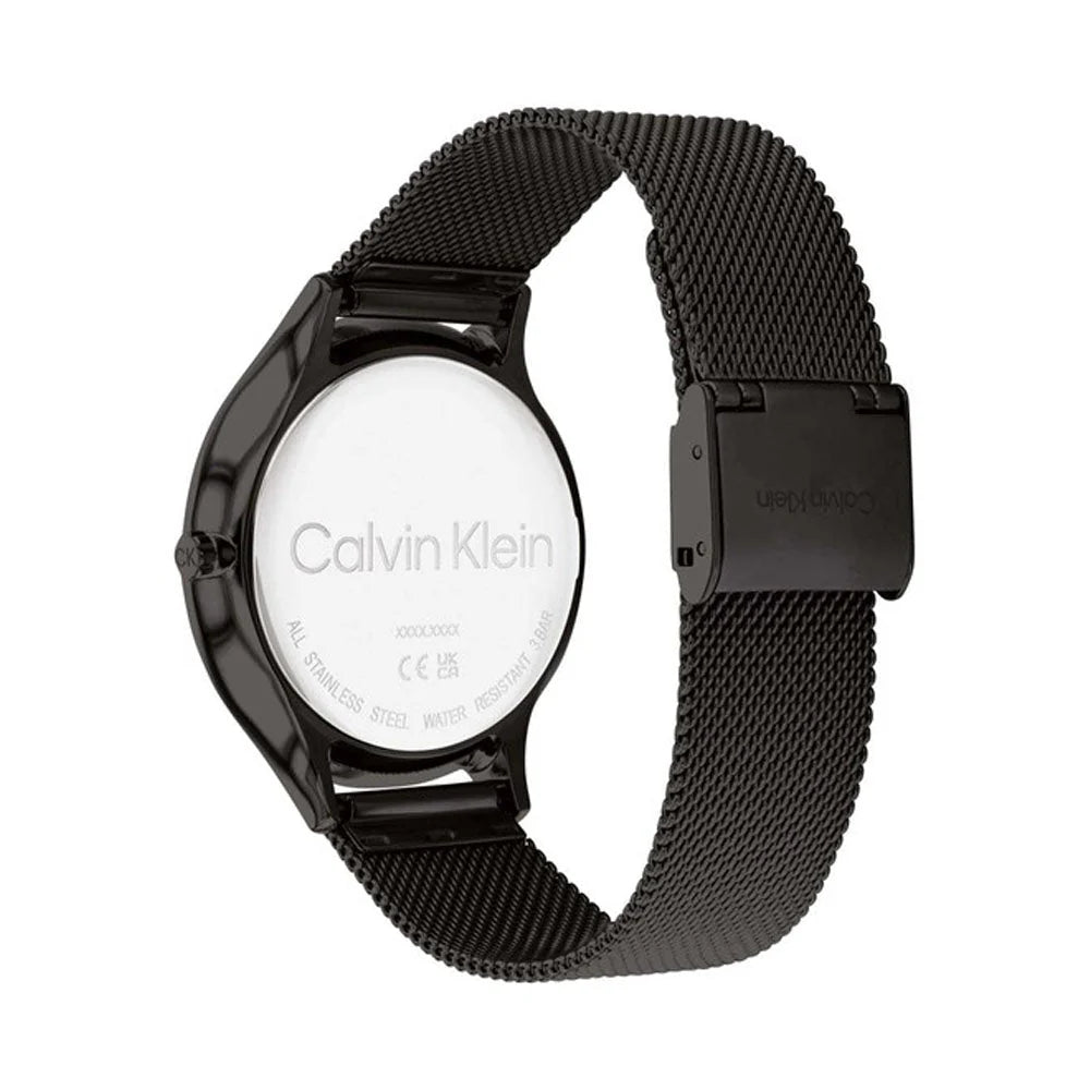Calvin Klein minimalist watch caseback showing engraved logo and mesh strap attachment