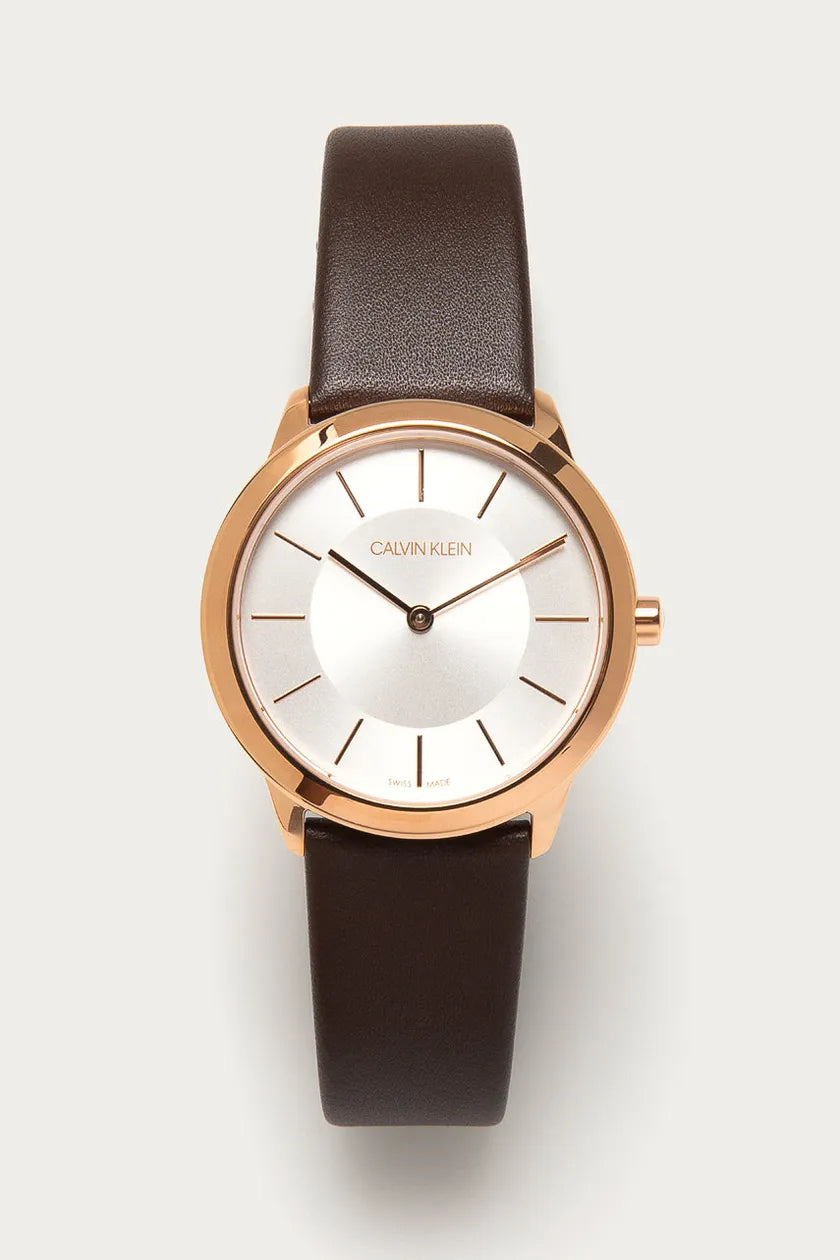 Calvin Klein Minimal watch angled view showing rose gold case with silver dial and brown strap