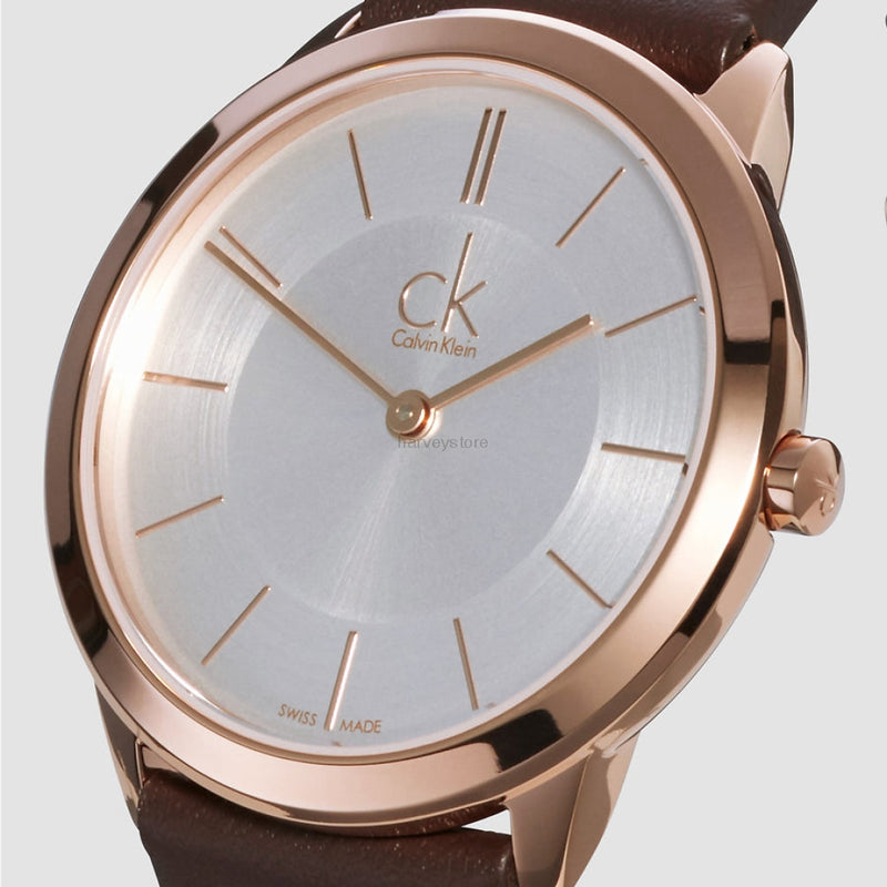 Close-up of Calvin Klein Minimal dial showing index markers, rose gold hands, and CK logo