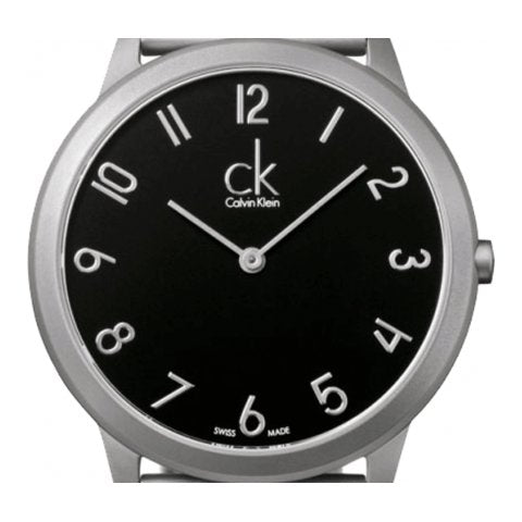 Close-up of Calvin Klein K3M51151 black dial with Arabic numerals and minimal design