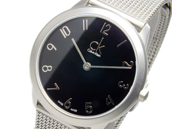 Calvin Klein K3M52151 dial detail showing black face with Arabic numerals and CK logo