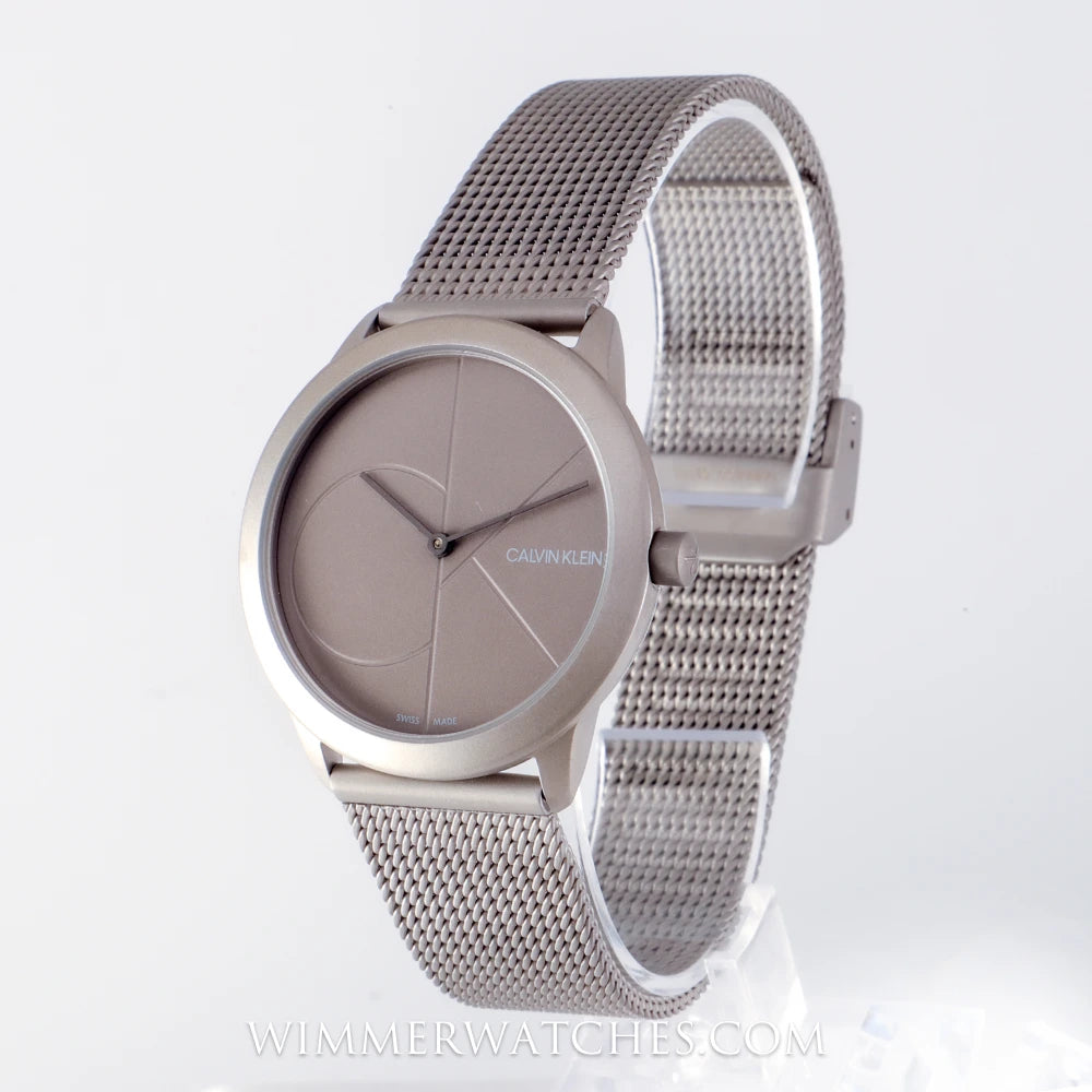 Calvin Klein Minimal silver mesh watch shown at angle displaying dial and bracelet