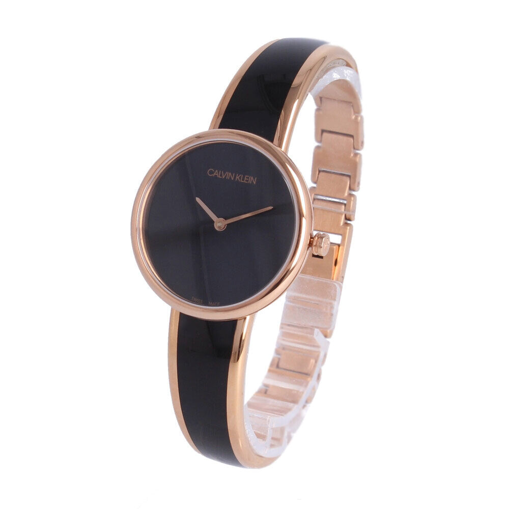 Angled view of Calvin Klein Seduce watch showing black dial and two-tone rose gold and black bracelet