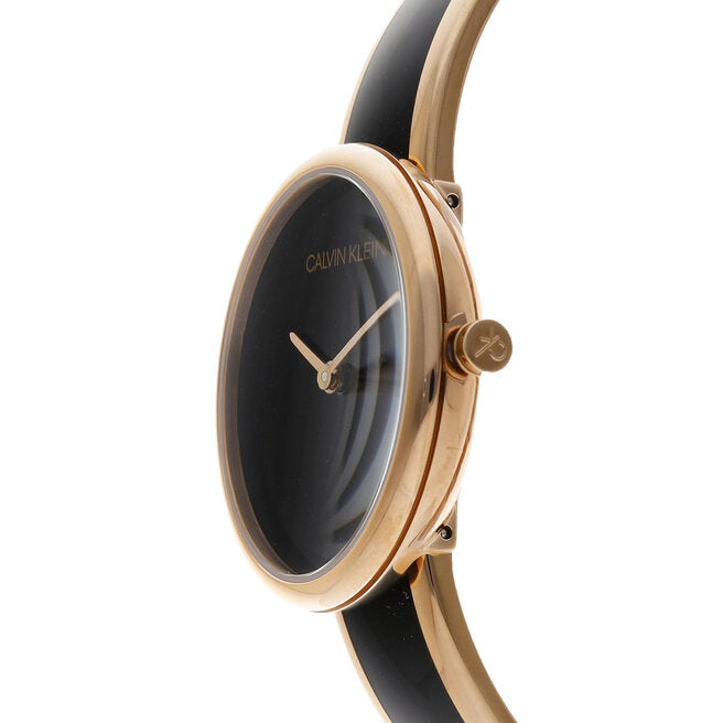 Side profile of Calvin Klein Seduce watch displaying rose gold case and black strap detail