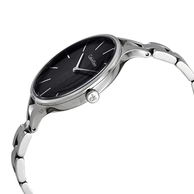 Angled side view of Calvin Klein bangle watch with slim profile
