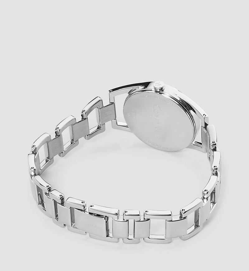 Side angle view of Calvin Klein Dainty watch showing steel case and link bracelet