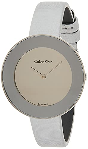Angled view of Calvin Klein Chic watch showing cream dial and gray fabric strap