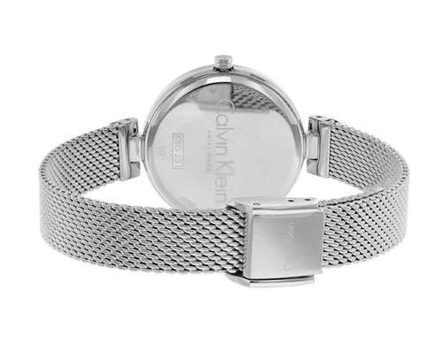 Calvin Klein watch caseback showing silver mesh bracelet and engrained casing