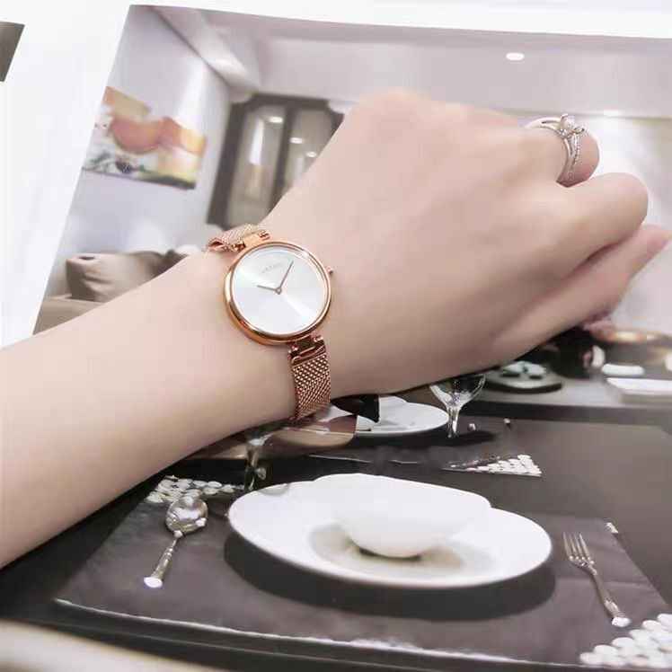 Rose gold women's watch worn on wrist